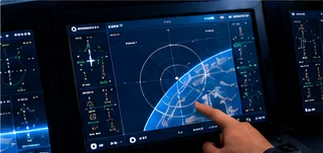 Hand interacting with a cockpit navigation display